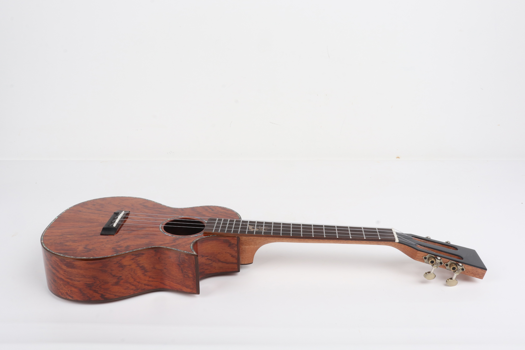 Padauk wood ukulele cutaway